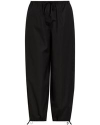 TOTEME - Drawstring Barrel-Leg Cotton Trousers - Lyst