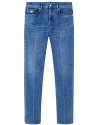 Versace - Logo-Patch Slim-Cut Denim Jeans - Lyst