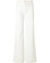 Nili Lotan - Florence High-Rise Distressed Flared Jeans - Lyst