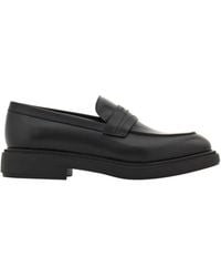 Ferragamo - Ferragamo Logo Embossed Slip-On Loafers - Lyst