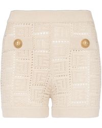 Balmain - Monogrammed Openwork Knit Mini Shorts - Lyst