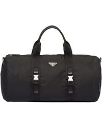 Prada - Logo Plaque Zip-Up Duffle Bag - Lyst