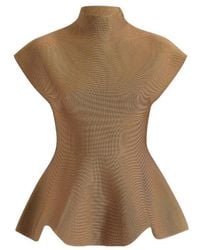 KHAITE - Andra Peplum Knit Top - Lyst