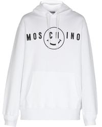Moschino - Logo Printed Drawstring Hoodie - Lyst
