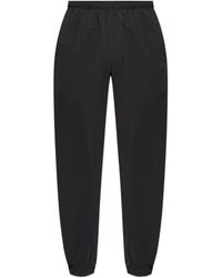 Moncler - Logo Patch Tapered-Leg Trousers - Lyst