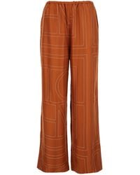 TOTEME - Totême Monogram-Patterned Wide-Leg Trousers - Lyst