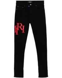 Amiri - Logo Appliqué Skinny Jeans - Lyst