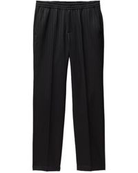 Versace - Pleated Monogram Pants - Lyst