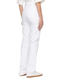 KHAITE - Slight Flared Jeans - Lyst