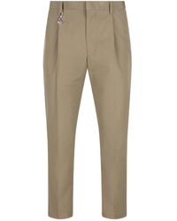 Prada - Pleated Cotton Trousers With Charm - Lyst