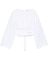 Alaïa - Alaïa Belted Cropped Top - Lyst