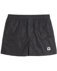 Valentino - Logo Embroidered Swim Shorts - Lyst