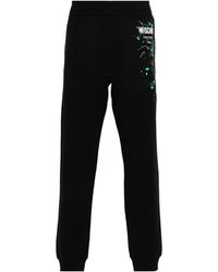 Moschino - Logo-Printed Trousers - Lyst