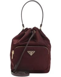 Prada - Logo Plaque Drawstring Bucket Bag - Lyst