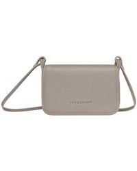 Longchamp - Logo Debossed Crossbody Bag - Lyst
