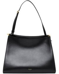 Alaïa - Alaïa Logo Printed Zipped Shoulder Bag - Lyst