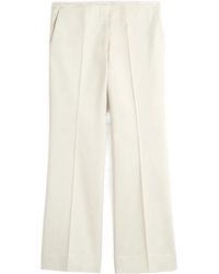 TOTEME - Totême Kick Flare Raw-Edge Pants - Lyst