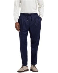 Brunello Cucinelli - Pleated Tapered Leg Trousers - Lyst