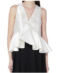Ganni - Ivory Satin Peplum Top - Lyst