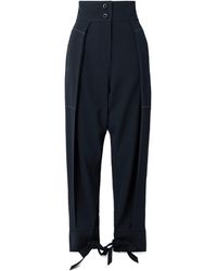 Sharon Wauchob - Paneled Pleated Wool-Twill Tapered Pants - Lyst