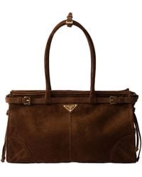 Prada - Triangle-Logo Drawstring Shoulder Bag - Lyst