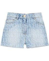Versace - Allover Logo Printed Denim Shorts - Lyst