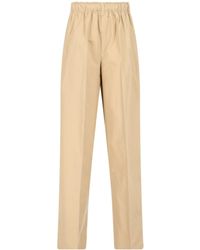 Prada - Triangle-Logo Plaque Wide-Leg Pants - Lyst