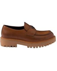 Prada - Logo Plaque Round Toe Loafers - Lyst