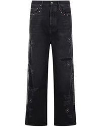Amiri - Distressed Bones Studded Baggy Jeans - Lyst