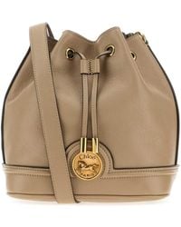 Chloé - Chloé Horse Medal Plaque Drawstring Bucket Bag - Lyst
