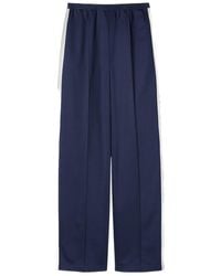 Gucci - Logo Embossed Technical Jersey Pants - Lyst
