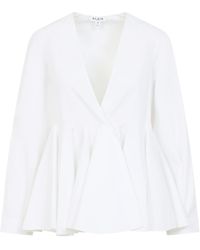 Alaïa - Alaïa V-Neck Flared Shirt - Lyst