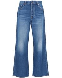 KHAITE - Buttoned Flared Jeans - Lyst