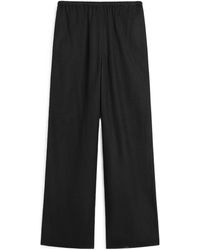 TOTEME - Totême Monogram Flannel Straight Leg Trousers - Lyst