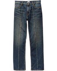 Versace - Logo-Patch Distressed Jeans - Lyst