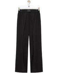 Loewe - Logo-Patch Pleated Trousers - Lyst