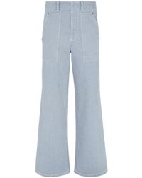 Fendi - Logo Embossed Wide-Leg Jeans - Lyst