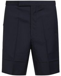 Prada - Triangle-Patch Pleated Shorts - Lyst