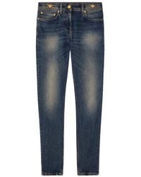 Versace - Logo-Patch Tapered Leg Jeans - Lyst