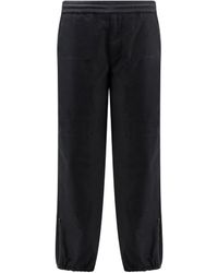 Moncler - Logo Embroidered Tapered Leg Trousers - Lyst