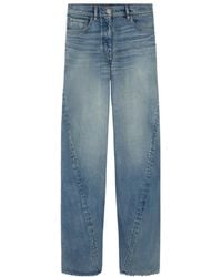 Versace - Logo-Patch Twisted Jeans - Lyst