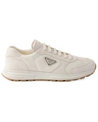 Prada - Triangle-Logo Lace-Up Sneakers - Lyst