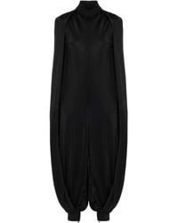 Alaïa - Alaïa Draped Turtleneck Jumpsuit - Lyst