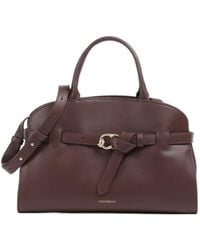 Coccinelle - Belted Top Handle Shoulder Bag - Lyst