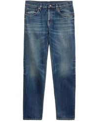 Prada - Logo-Patch Denim Jeans - Lyst