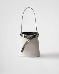 Prada - Buckle Leather Bucket Bag With Studded Belt - Lyst