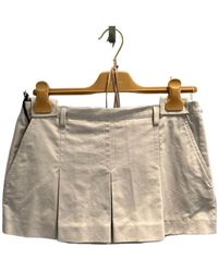Miu Miu - Low-Rise Logo-Buckle Pleated Mini Skirt - Lyst