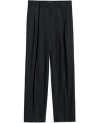 TOTEME - Totême Pleat Detailed Pinstriped Trousers - Lyst