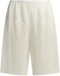 KHAITE - Poppy Pleated Knee-Length Shorts - Lyst