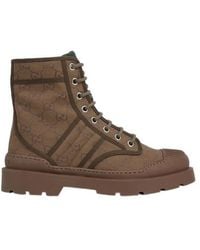 Gucci - Monogrammed Lace-Up Boots - Lyst